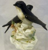 A Meissen figural group of two house martins bearing blue crossed swords mark and stamped "J192" to