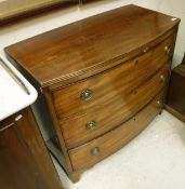 A Regency mahogany bow front chest of three long drawers raised on bracket feet