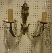 Six twin branch brass wall sconces with glass drops in the Rococo taste,