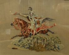 A 19th Century needlework of a horseman on horseback going over a fence