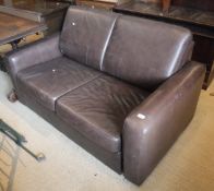 A John Lewis brown leather two seat sofa bed