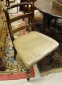 A set of six early 19th Century mahogany bar back dining chairs with upholstered seats on turned