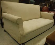 A three seat sofa on turned mahogany feet
