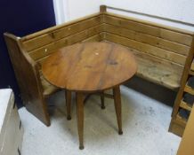A modern pine corner bench together with an elm tavern type table raised on four legs