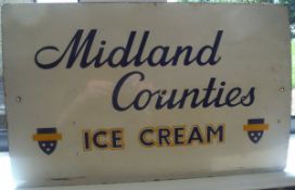 An enamel sign "Midland Counties Ice Cream"