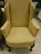 A Georgian style wing back arm chair,