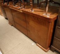 A 20th Century sideboard with pull-out marble slide above cupboard doors to bracket feet