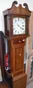 An oak and mahogany banded long case clock with Roman numerals to the dial