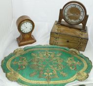 A mahogany and inlaid balloon-shaped mantle clock with Roman numerals to the dial,