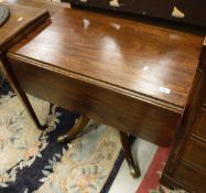 A 19th Century mahogany Pembroke table with single end drawer opposite a dummy drawer,