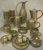 A collection of Selangor pewter wares to include teapot, coffee pot, hot water pot, various beakers,