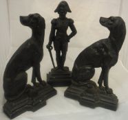 Two iron door stops cast as seated dogs looking backwards with Victorian diamond kite marks verso,