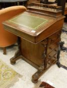 A Victorian burr walnut and inlaid Davenport desk with stationery compartment over a writing