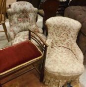 Two salon chairs in foliate ground patterned upholstery,