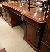 A 19th Century mahogany pedestal sideboard with large mirrored back and carved and moulded frame