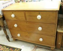 A pine chest of two short of two long drawers to turned feet