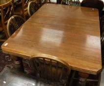 An Edwardian mahogany extending dining table,