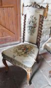 A Victorian rosewood framed hall chair with shaped top rail and needlework upholstered seat and