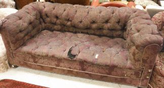 A Victorian Chesterfield sofa on squat bun feet