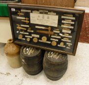 A glazed display case containing various beer taps, bungs, shives & spiles,