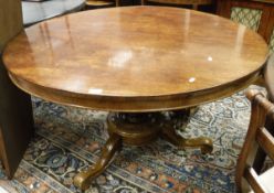A Victorian mahogany centre table, the circular top raised on central pedestal to tripod legs,