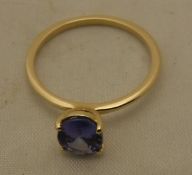A tanzanite 14 carat gold set ring