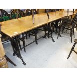 Two Victorian draughtsmans tables with mahogany tops and set with brass rules raised on matching