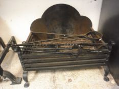 A wrought iron fire basket by Williams of Rodmarton, together with a spark guard, log fork,