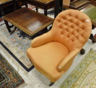 A Victorian salon chair with button back,