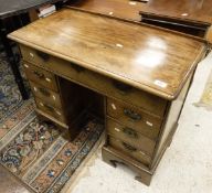A 19th Century mahogany kneehole desk of small proportions, the plain top above single drawer,