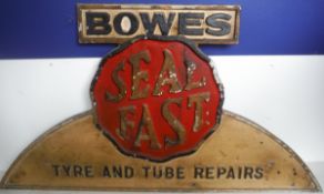 A cast aluminium and painted sign "Bowes Seal First Tyre and Tube Repairs"
