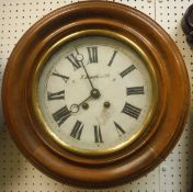 A mahogany cased wall clock with Roman numerals to the dial, indistinctly marked "J.