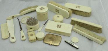 A collection of early 20th Century yellow metal mounted ivory-handled dressing table accoutrements