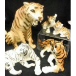 Assorted Lomonosov and other porcelain figures of tigers and one leopard including white tiger and