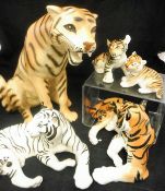 Assorted Lomonosov and other porcelain figures of tigers and one leopard including white tiger and