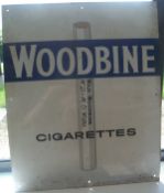 An enamel advertising sign "W D & H O Wills Woodbine,