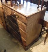 An 18th Century oak and mahogany banded North Country chest of two short over three long graduated