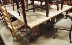 A pair of oak rectangular refectory tables on trestle stile supports