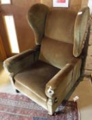 A Victorian reclining arm chair in olive green upholstery