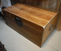 An Oriental campher wood trunk with brass carry handles