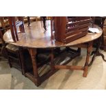 A modern oak oval gate-leg drop-leaf dining table by Lyon House Antiques,