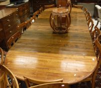 A stained beech extending dining table with six leaves CONDITION REPORTS Does not
