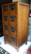 A modern chest of eight short drawers in the Chinese taste