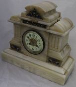 A white onyx mantle clock with Arabic numerals to the dial and champlevé decoration