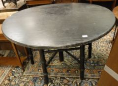 A modern oak and ebonised Arts and Crafts style dining / library table (originally designed by
