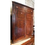 An 18th Century oak and mahogany banded North Country wall hanging twin door corner cabinet
