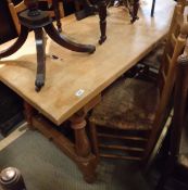 A 20th Century modern beech topped dining table on pine base,