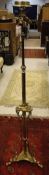 A brass floor lamp in the French Empire taste