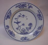 A late 18th / early 19th Century Chinese blue and white charger decorated with a bird on a