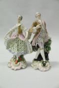 A pair of 19th Century Meissen figures of a lady and gentleman in 18th Century dress,